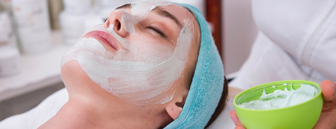 A woman laying down receiving a beauty treatment