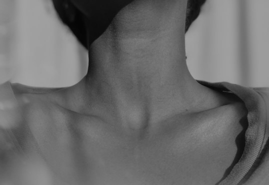 woman showing her neck line